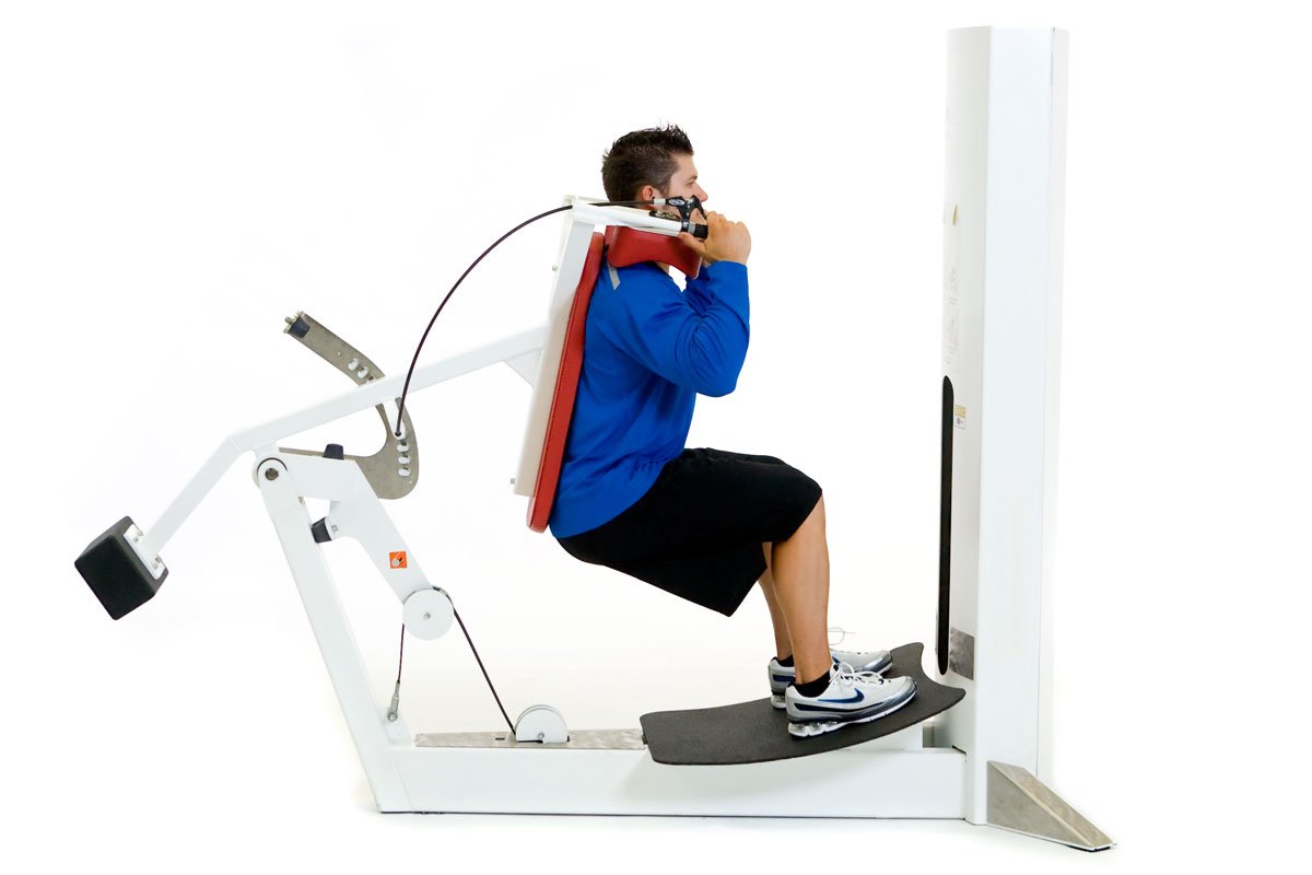 client doing a hack squat with a machine