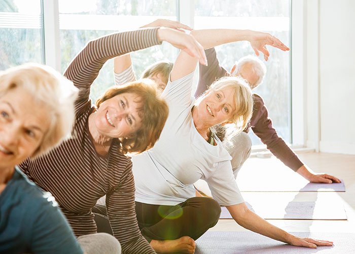 older-group-doing-yoga