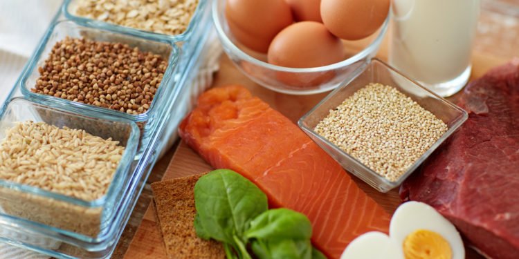 Salmon, eggs, and grains on table 
