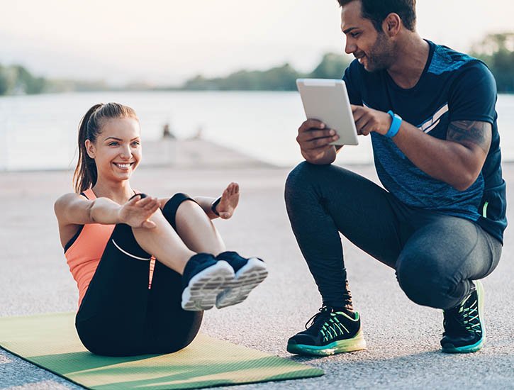 personal trainer training a client